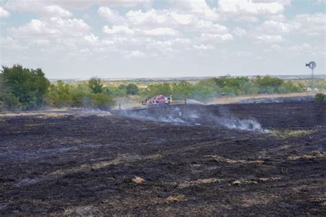 Crews contain brush fire caused by unapproved burning on private property